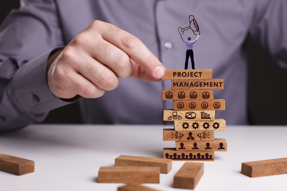 Stack of blocks demonstrating why a company would need productivity tools